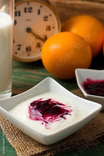 Table with prepared breakfast with yogurth