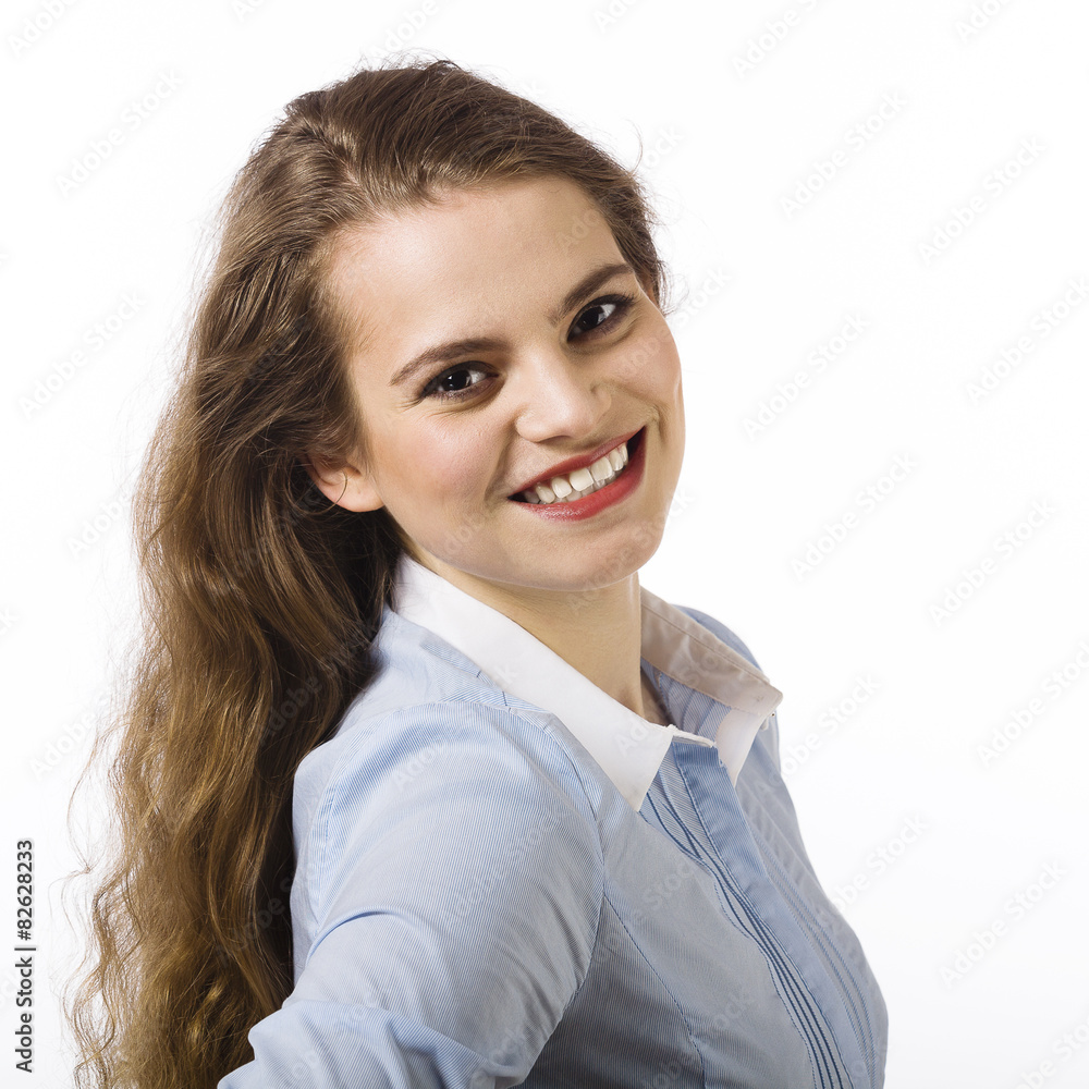 Portrait of a beautiful smiling young woman dressed in a blue sh Portrait of a beautiful smiling young woman dressed in a blue sh