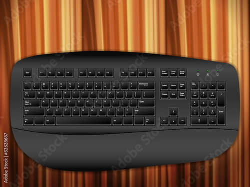computer keyboard on wooden desk