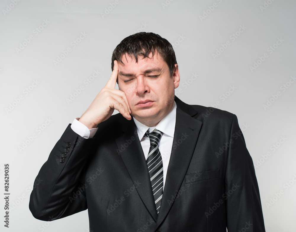 businessman in depression with hands on his head businessman in depression with hands on his head