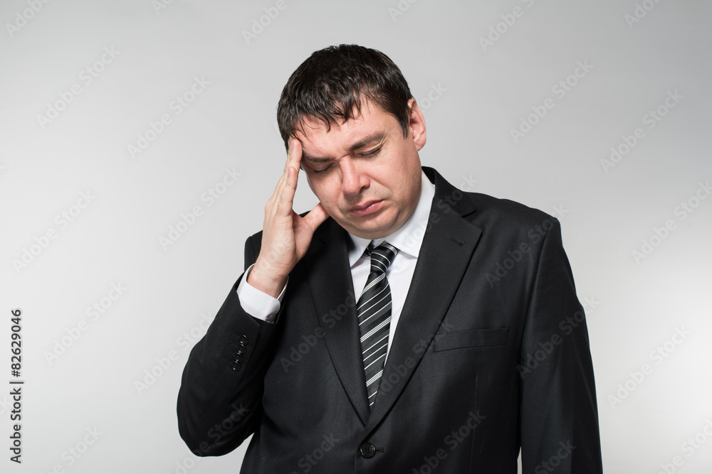 businessman in depression with hands on his head businessman in depression with hands on his head