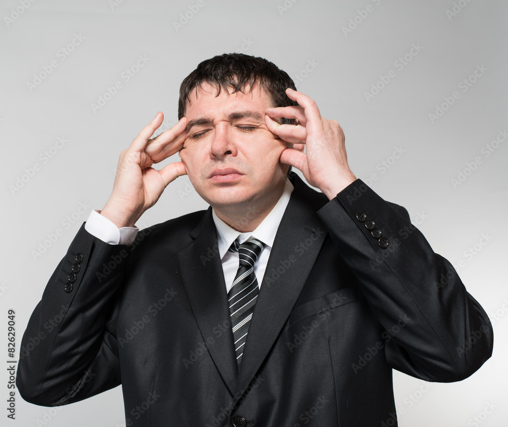businessman in depression with hands on his head businessman in depression with hands on his head