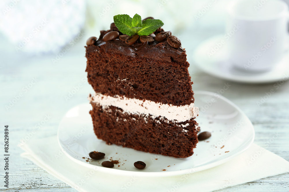 Delicious chocolate cake on table on light background Delicious chocolate cake on table on light background