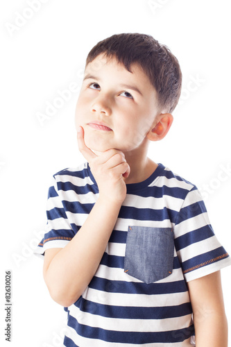 Thoughtful boy with finger on chin