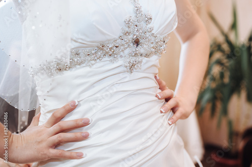 Bride getting ready. beautiful bride in white wedding dress with