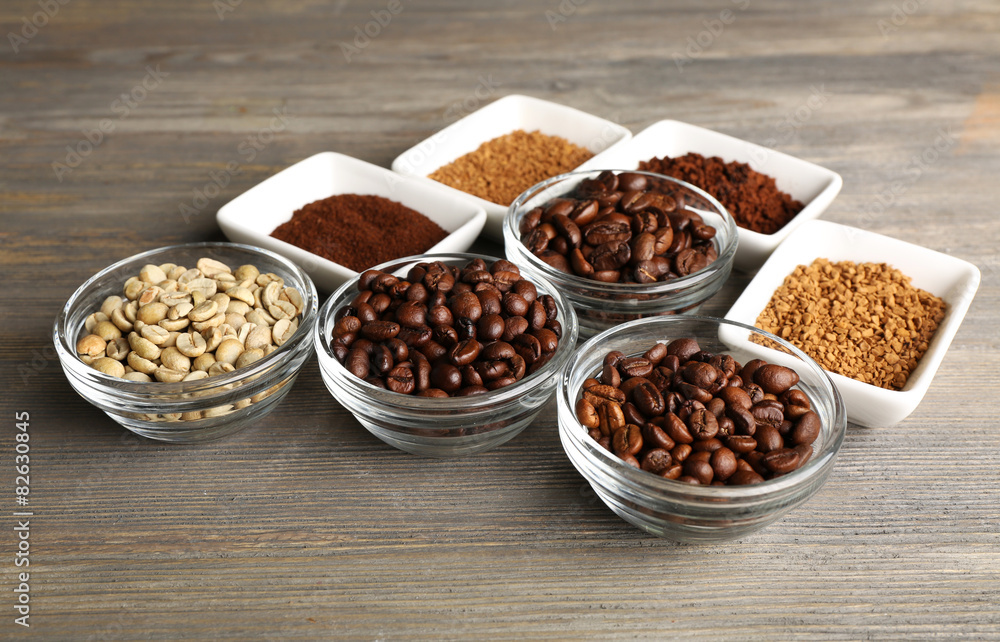 Coffee beans in saucers on wooden background Coffee beans in saucers on wooden background