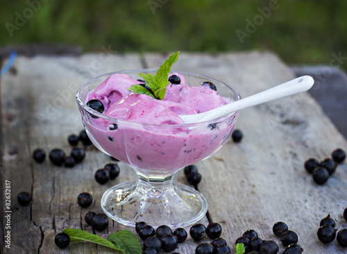 blackcurrant ice cream  on the old table photo