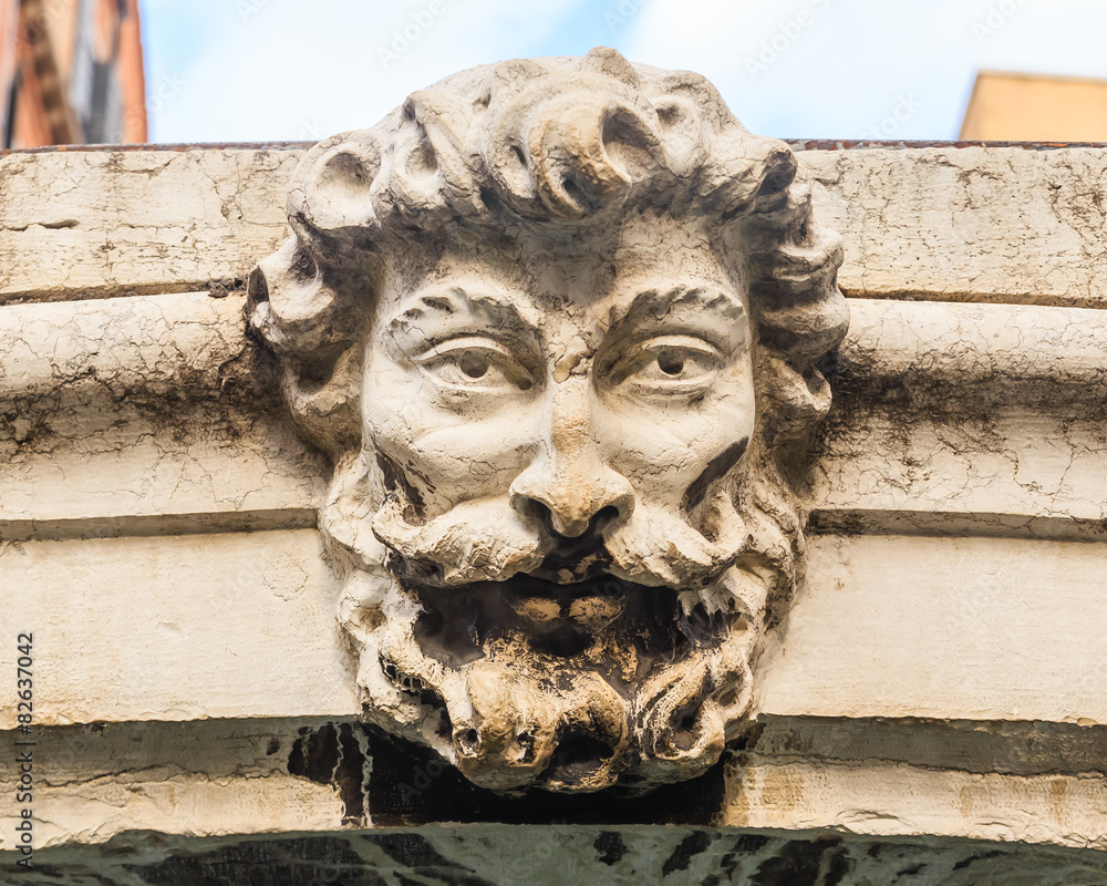 Fototapeta premium The bas-relief on the bridge over a canal in Venice