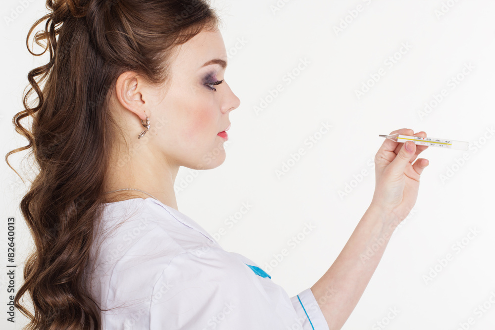 Pretty young female doctor with thermometer Pretty young female doctor with thermometer
