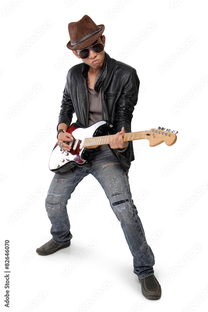 Fototapeta premium Rock guitarist strumming his guitar, isolated on white