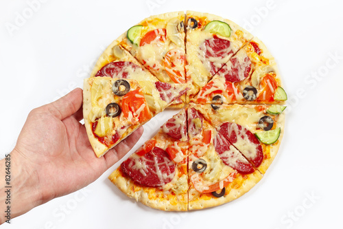 Hand man takes a piece of tasty pizza on a white background