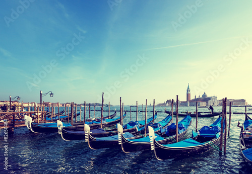 Gondolas on Grand Canal and San Giorgio Maggiore church in Venic photo