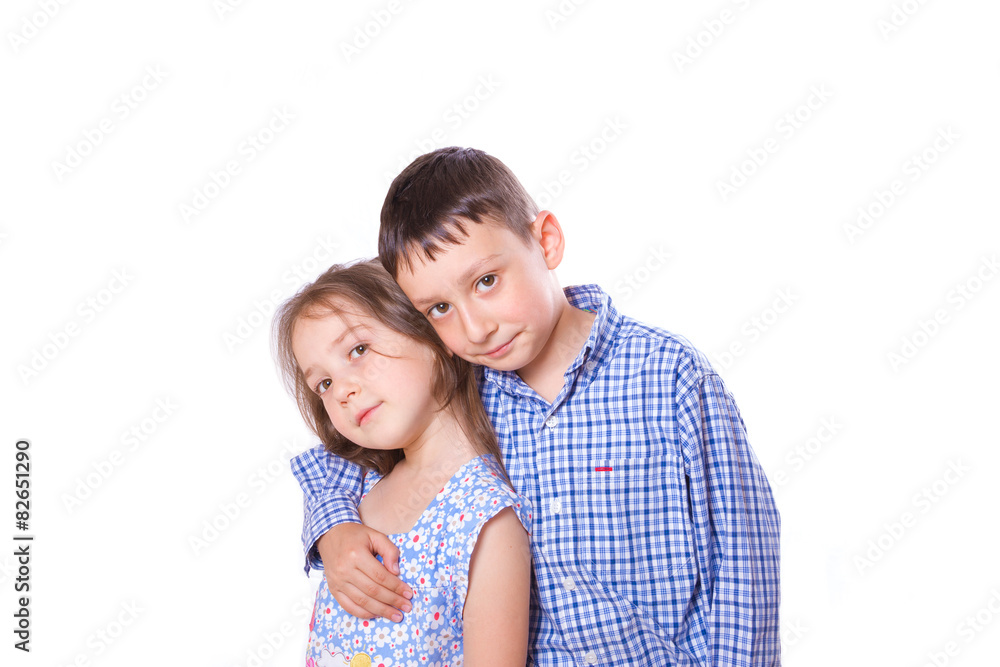 Brother sister hugging kcherz shoulder and smiling together on white background Brother sister hugging kcherz shoulder and smiling together on white background