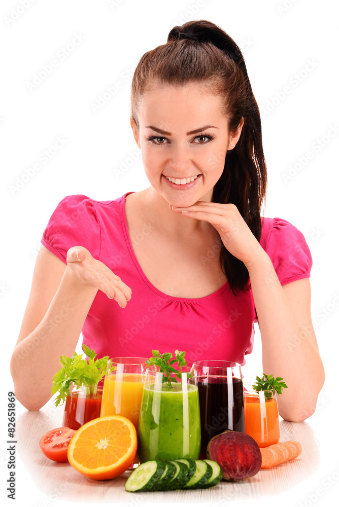Young woman with variety of vegetable and fruit juices Young woman with variety of vegetable and fruit juices