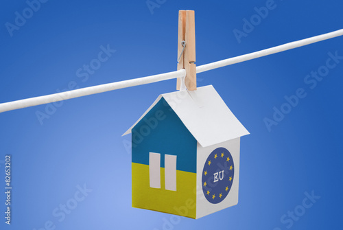 Ukraine, Ukrainian and EU flag on paper house photo