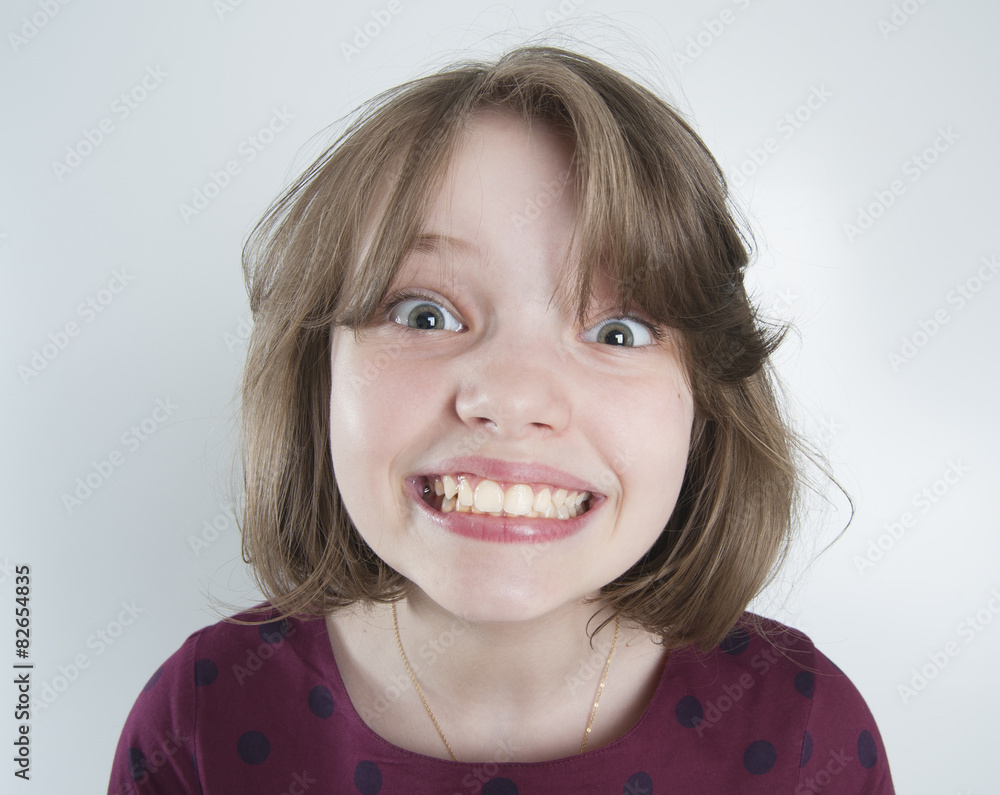 Ten-year girl with a funny smile.. Ten-year girl with a funny smile..