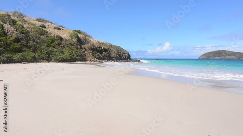 Man hikes on virgin beach on Isla Culebra in Caribbean Sea