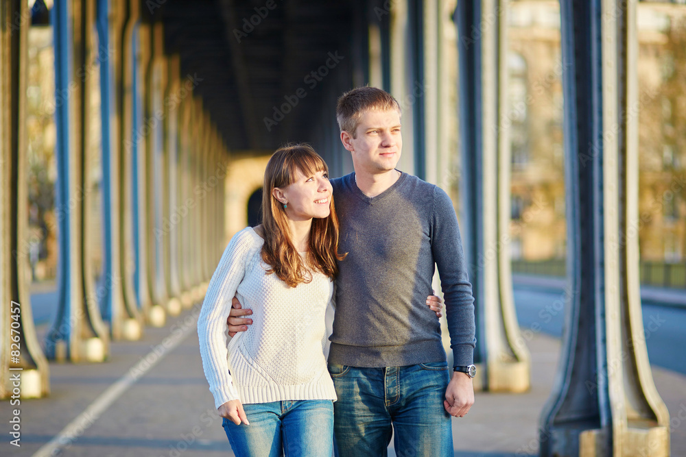 Couple in Paris on the Bir Hakeim bridge