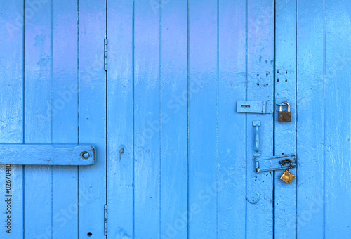 Closeup wooden blue door background
