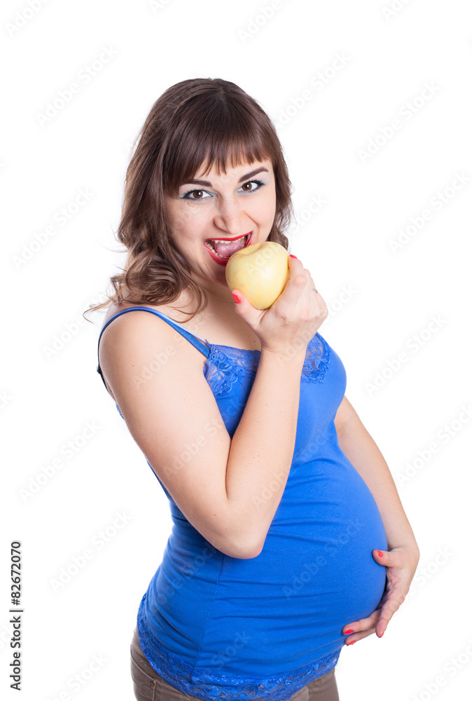 Attractive pregnant woman girl biting apple Attractive pregnant woman girl biting apple