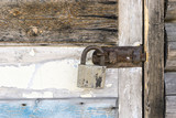 Rustic door locked with padlock