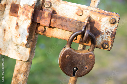 Padlock / Old padlock on a fence