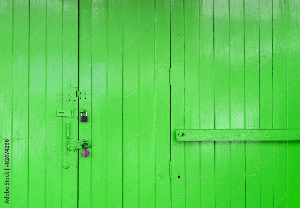 Fototapeta premium Wooden strong green door with lock