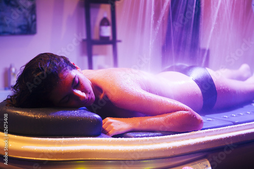 Woman during spa treatment with water.