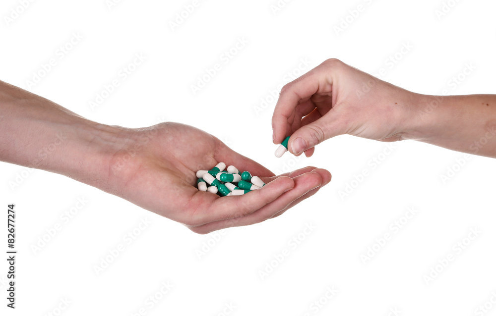 Taking pill from hand, Isolated on white Taking pill from hand, Isolated on white