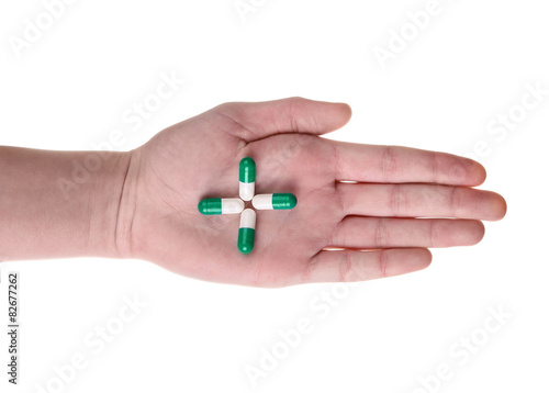 Pills in hand isolated on white background