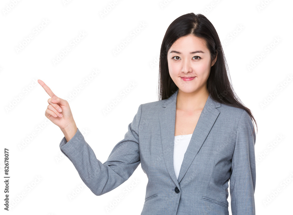 Asian businesswoman with finger pointing up Asian businesswoman with finger pointing up