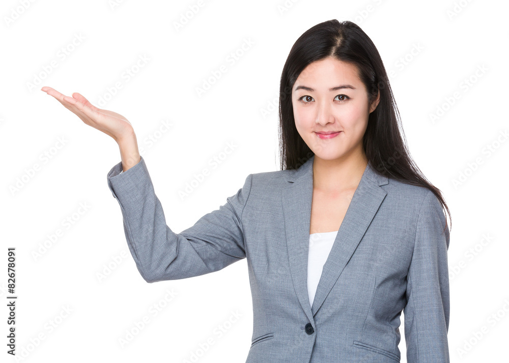 Businesswoman with hand showing something Businesswoman with hand showing something