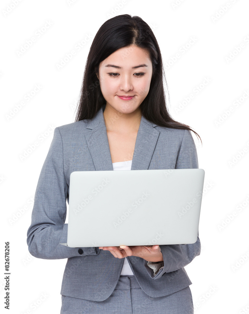 Young businesswoman look at the notebook computer Young businesswoman look at the notebook computer