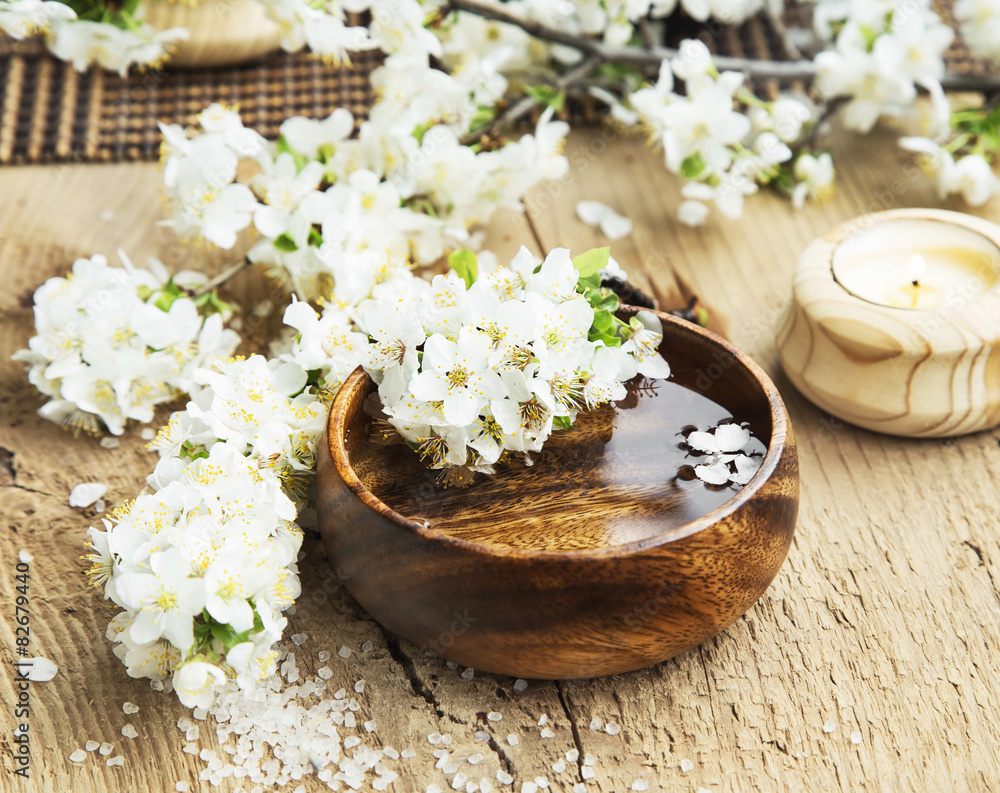 Spa Setting with Flower Blossom in Wooden Water Bowl Spa Setting with Flower Blossom in Wooden Water Bowl