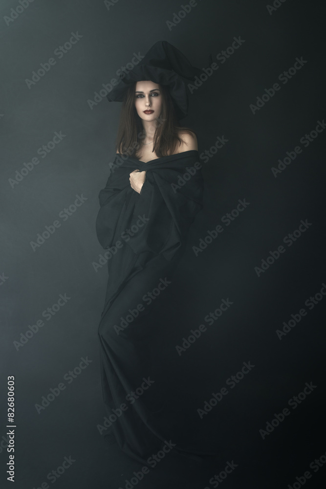 slender witch in a smoke on black background slender witch in a smoke on black background