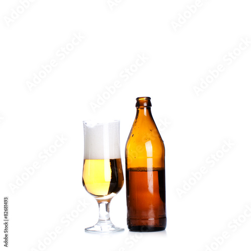 Isolated Glass and Brown bottle of beer on a white