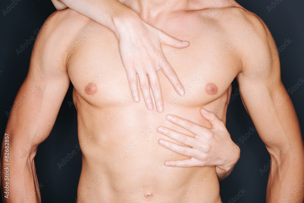 Woman hands on a man's chest