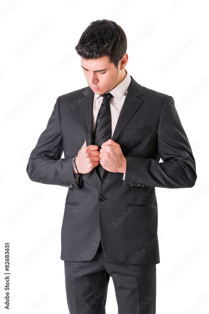 Young businessman confidently posing isolated on white Young businessman confidently posing isolated on white