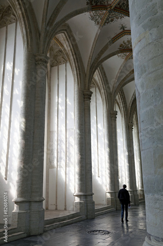 man in interior of breda cathedral in holland
