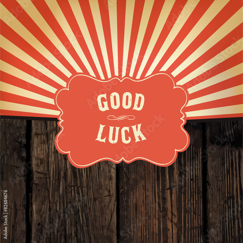 Wild west styled "Good Luck" message on wooden board. With red r