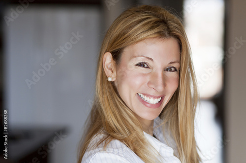 Beautiful blond woman smiling at the camera
