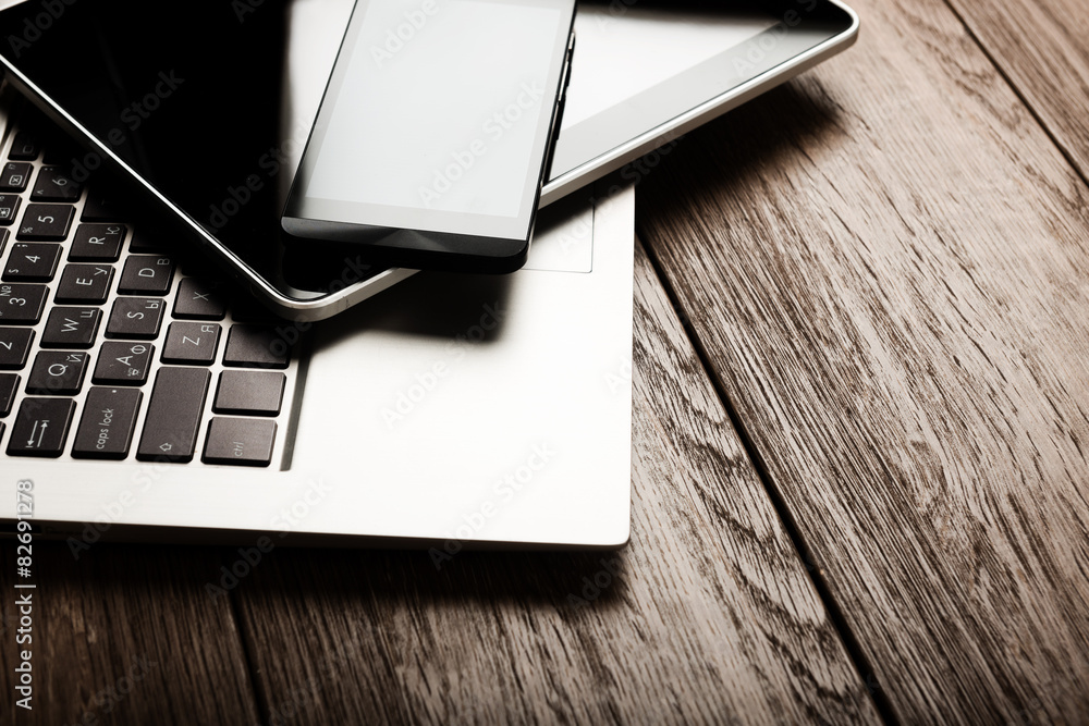 keyboard with phone and tablet pc on wooden desk keyboard with phone and tablet pc on wooden desk
