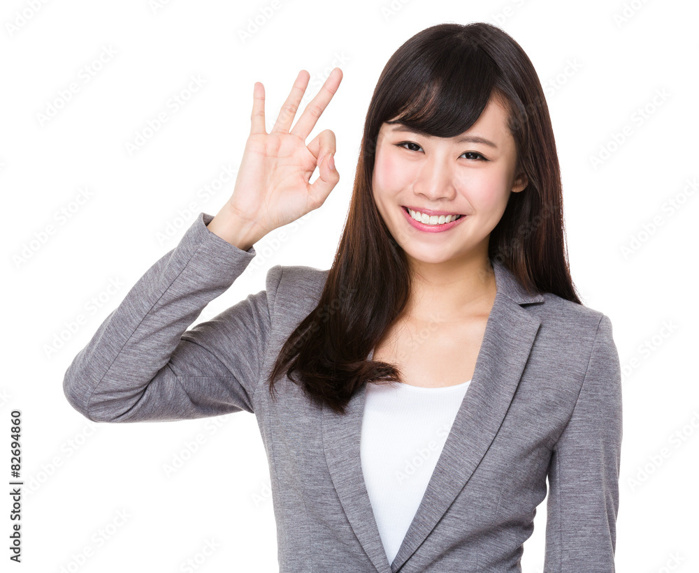 Asian businesswoman with ok gesture Asian businesswoman with ok gesture