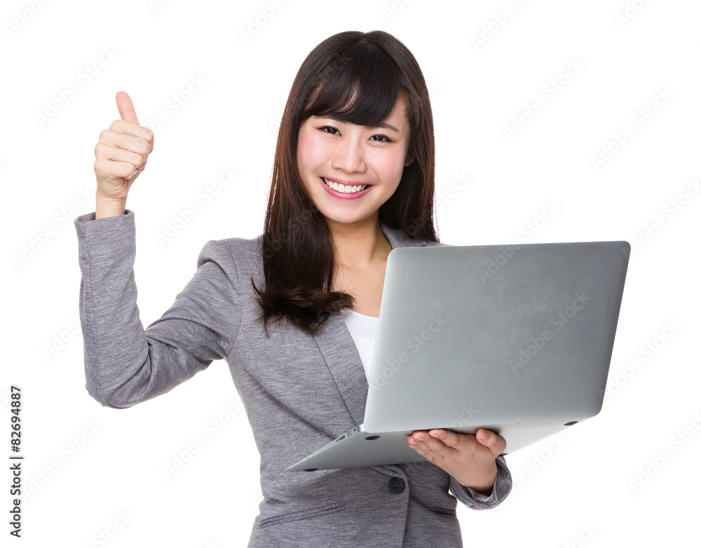 Asian businesswoman use of laptop and thumb up Asian businesswoman use of laptop and thumb up