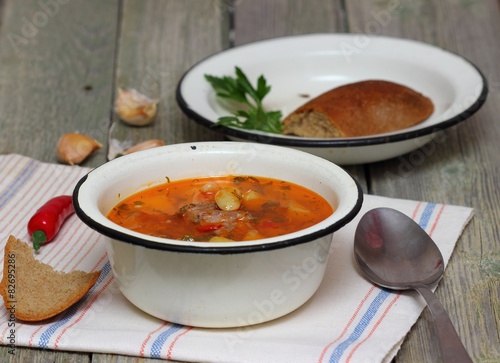 Meat soup with vegetables .