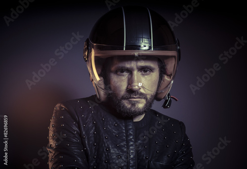 Trip, biker with motorcycle helmet and black leather jacket, met