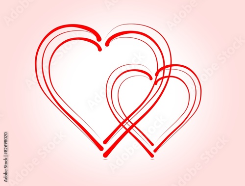 Two overlapping hearts on pink paper