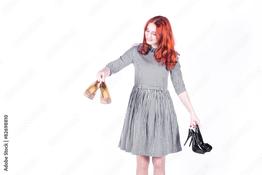 Happy woman looks at the shoes she had bought Happy woman looks at the shoes she had bought