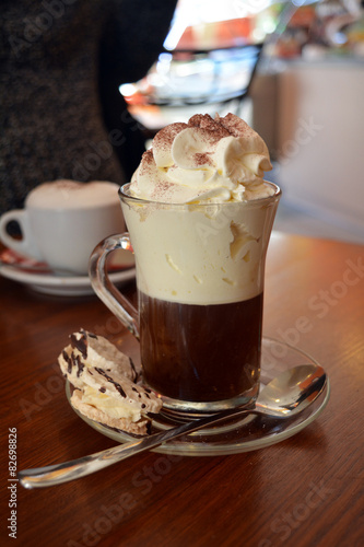Photography Delicious Viennese coffee in glass cup with whipped cream
