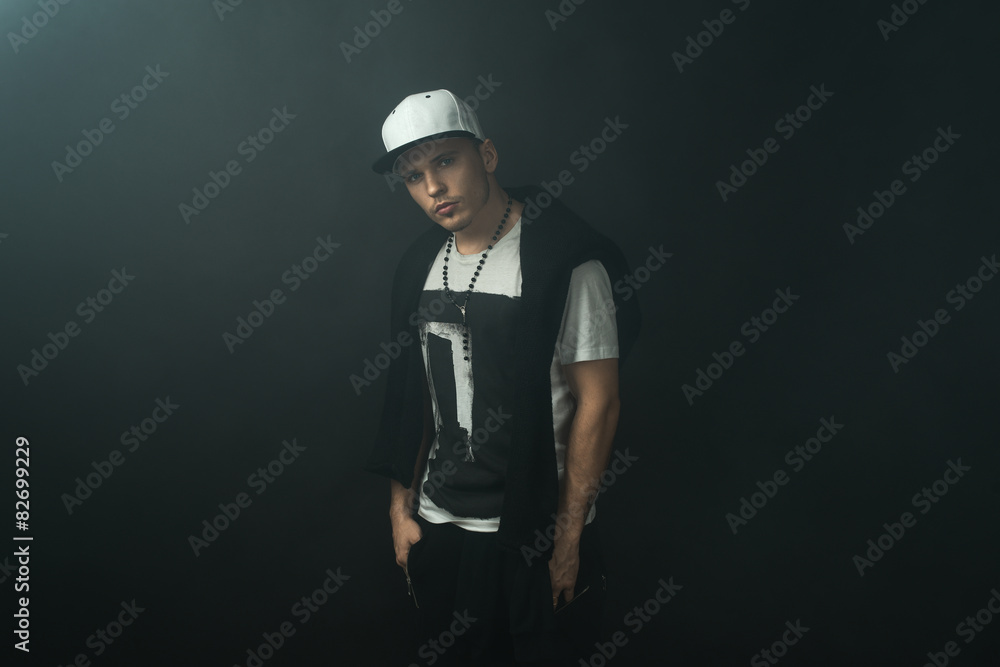 Fashionable stylish man in  darkness